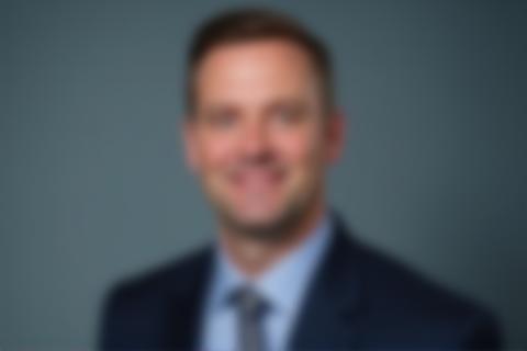 Professional corporate headshot of a businessman.