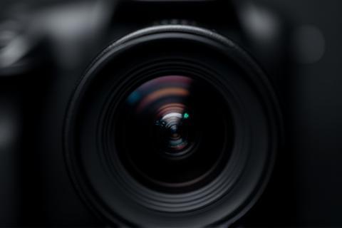 Camera lens focusing on a subject.